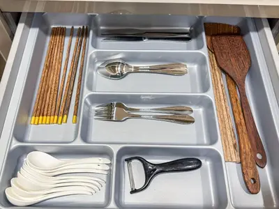 a drawer filled with utensils in a refrigerator at Bangkok High-Floor Luxury Suite 2 Bedrooms 2 Bathrooms King & Queen Bed Sky Pool Heart of Siam District 曼谷高层奢华套房 两卧两卫 特大床 大床 无边泳池 坐落暹罗商圈核心 in Bangkok