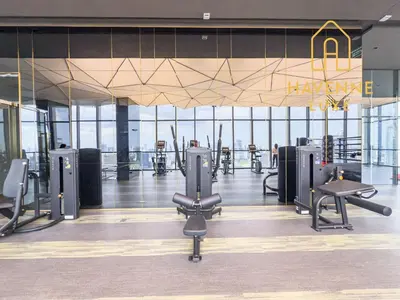 a gym with treadmills and exercise equipment in a building at New City Condo in Central Bangkok in Pratunam
