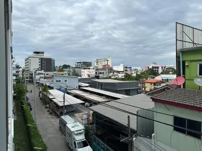 a view of a city with buildings and a street at Cozy Room - On Nut - Wi-Fi, Gym, Pool in Bangkok