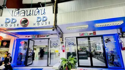 a woman standing in front of a dvd house at Bangkok-Pratunam Hotel in Bangkok