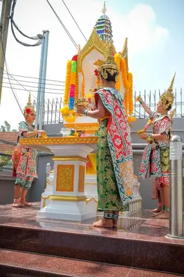a group of people standing around a shrine at B32 Apartment in Bangna
