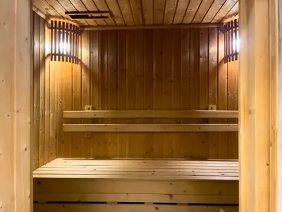 a sauna with wooden walls and shelves in it at 300m BTS l Large 110 sqm l Pool and Sauna in Bangkok