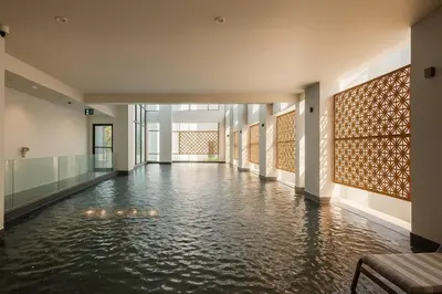 a hallway with a pool of water in a building at Incredible Loft with High Ceiling in Bangkok