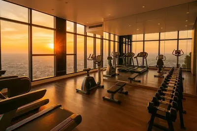 a gym with rows of exercise equipment in a building at Incredible Loft with High Ceiling in Bangkok