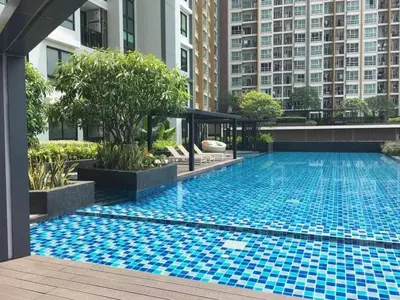 a swimming pool in the middle of a building at Cozy&Bright apartment -Onnut BTS in Bangkok
