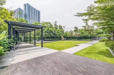 a park with a pavilion and a grass field at Cozy&Bright apartment -Onnut BTS in Bangkok