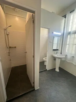 a bathroom with a toilet and a sink at Siam Place - In the Heart of Bangkok in Bangkok