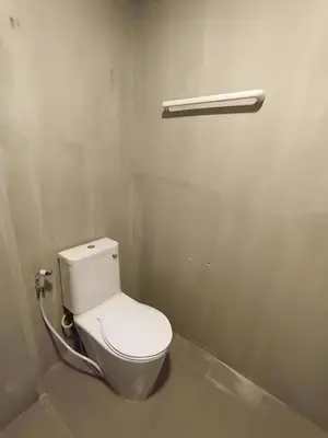a bathroom with a white toilet in a room at XX GO INN Silom BTS Saint Loius - เซนหลุย in Yan Nawa