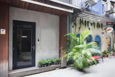a building with plants on the side of it at XX GO INN Silom BTS Saint Loius - เซนหลุย in Yan Nawa
