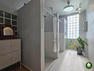 a bathroom with a walk in shower and a sink at Obahomu Vacation House for 4-8 pax, 5 min walk to Icon Siam in Bangkok