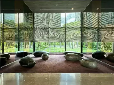 a room with a large window with vases on the floor at Peaceful Stylish and cozy condo in Khlong Toei