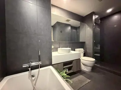 a bathroom with a tub and a sink and a toilet at 2 bed 2 bath luxury appartment Convention Center in Bangkok