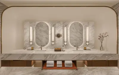a bathroom with three sinks and three mirrors at Andaz One Bangkok in Bangkok