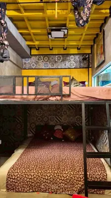 a bedroom with a bunk bed in a room at โรงแรม เลิฟ บีเคเค in Amphoe Phra Khanong