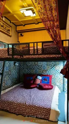 a bedroom with a bunk bed with pillows on it at โรงแรม เลิฟ บีเคเค in Amphoe Phra Khanong