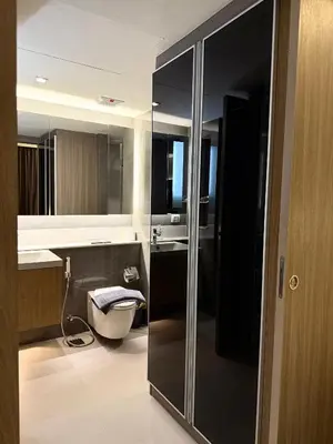 a bathroom with a sink and a toilet in it at Cozy room in Sukumvit in Bangkok