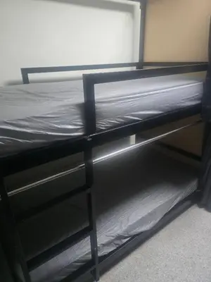 a black bunk bed with the bottom at Cozy bangkok hostel in Bangkok