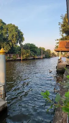 a river with a building on the side of it at Old Town cozy corner in Thonhuri