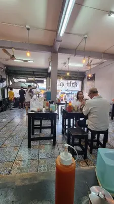 two people sitting at tables in a restaurant at Old Town cozy corner in Thonhuri
