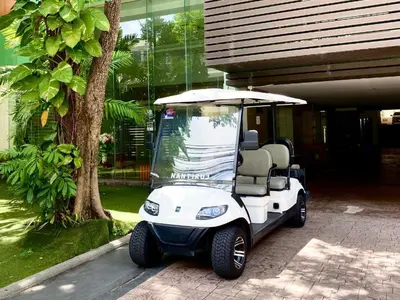 a golf cart parked in front of a house at Modern 2 Bed Executive Unit 5min to Nana BTS in Bangkok