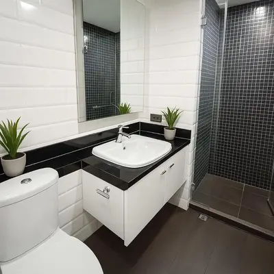 a bathroom with a toilet and a sink and a shower at Nana SkyView Retreat 2 Bedroom 2 Bath Nana BTS in Bangkok