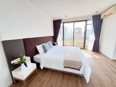 a bedroom with a large bed and a large window at Nana SkyView Retreat 2 Bedroom 2 Bath Nana BTS in Bangkok
