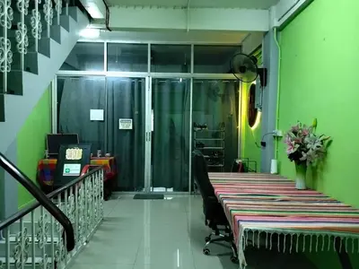 an office with a long table in a green room at A fantastic house next to W district food market in Amphoe Phra Khanong