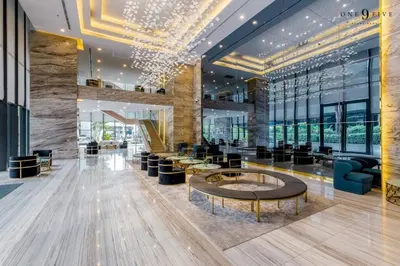 a lobby of a building with a table and chairs at 49floor with Workspace Pool and Gym with MRT 200m in Bangkok