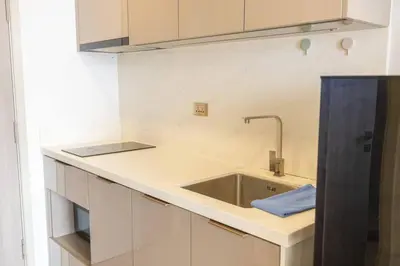 a kitchen with a sink and a counter top at 49floor with Workspace Pool and Gym with MRT 200m in Bangkok
