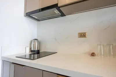 a kitchen counter with a coffee maker on it at High Skyview Studio with Desk Pool Gym MRT 200m in Ban Na Song