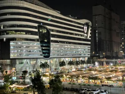 a large building with a traffic light in front of it at High Floor Apt with Large Living Room Pool and Gym in Ban Na Song