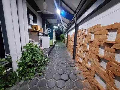 a hallway of a building with stacks of wood at Irich Theparak S207- Bts-Chang Erawan 2kms in Ban Khlong Hua Sakae