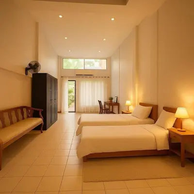 a hotel room with two beds and a couch at Niche Space Sripraya- Samyan in Bangkok