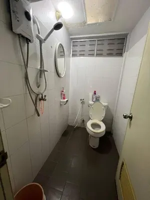 a small bathroom with a toilet and a mirror at Niche Space Sripraya- Samyan in Bangkok