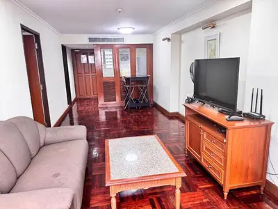 a living room with a couch and a flat screen tv at Beautiful 1 bedroom Appartment in the Heart of Bangkok in Bangkok