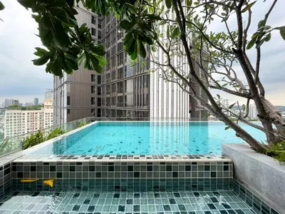 a swimming pool on the roof of a building at 500m to BTS l Large 50 sqm l Workspace l By Sontana in Bangkok