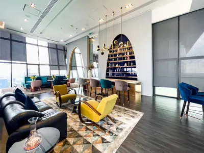 a living room with couches and chairs and a table at Near BTS l Fully Furnished l Pool and Gym l Sontana in Bangkok