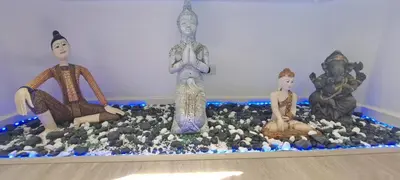 a group of statues sitting on top of a table at Newly renovated 1 bedroom condo NANA in Bang Kapi