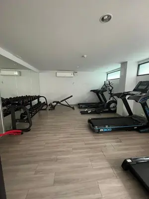 a gym with several treadmills and cardio machines at AC Home 2 Laksi in Lak Si