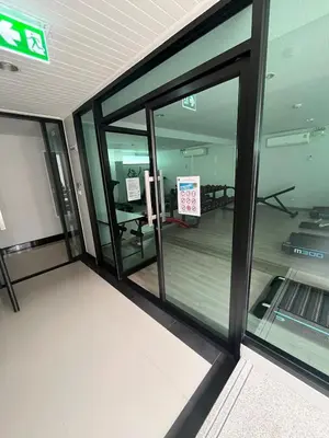 an empty room with glass windows in a building at AC Home 2 Laksi in Lak Si