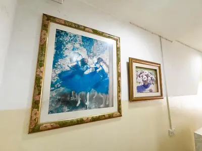 two framed pictures hanging on a wall at Blissful Heaven Residence at BTS Phromphong Emdistrict Shopping Area in Bangkok