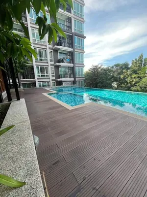 a swimming pool in front of a building at AC Home 1 Laksi in Lak Si