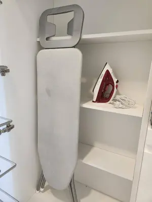 a white toilet in a room with shelves at Prime 1BR in Sukhumvit 11 CentralStylishModern in Makkasan