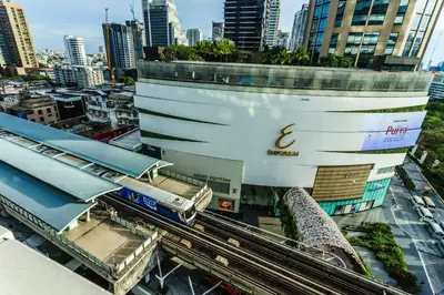 a train station in front of a tall building at Prime 1BR in Sukhumvit 11 CentralStylishModern in Makkasan