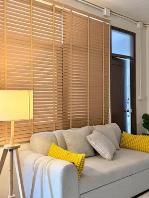 a couch with yellow pillows sitting in a living room at Spacious 2BD 2BA Apartment in Thong Lor in Khlong Toei