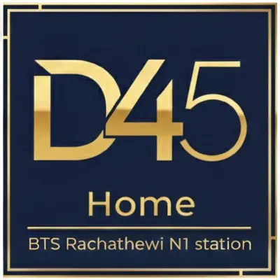 a blue sign with the in gold at D45 Home - BTS Ratchathewi N1 Station in Bangkok