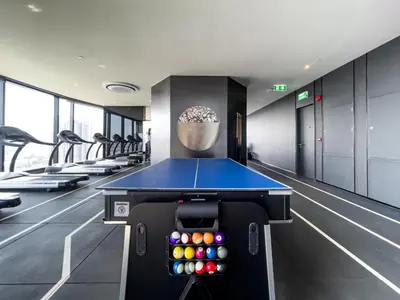a ping pong table in a gym with balls at 250m BTS l Duplex Unit l Rooftop Pool l Sontana in Bangkok
