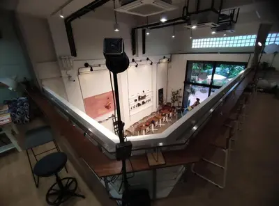 an overhead view of a room with chairs and a stage at BubbleHumbleBangkok in Bangkok