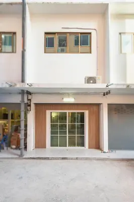 a building with a garage with a window at Siam Central 2BR Yumi house Near IconSiam in Bangkok