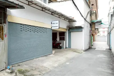 a garage door on the side of a building at XX Mitr Khaosan Bangkok in Bangkok